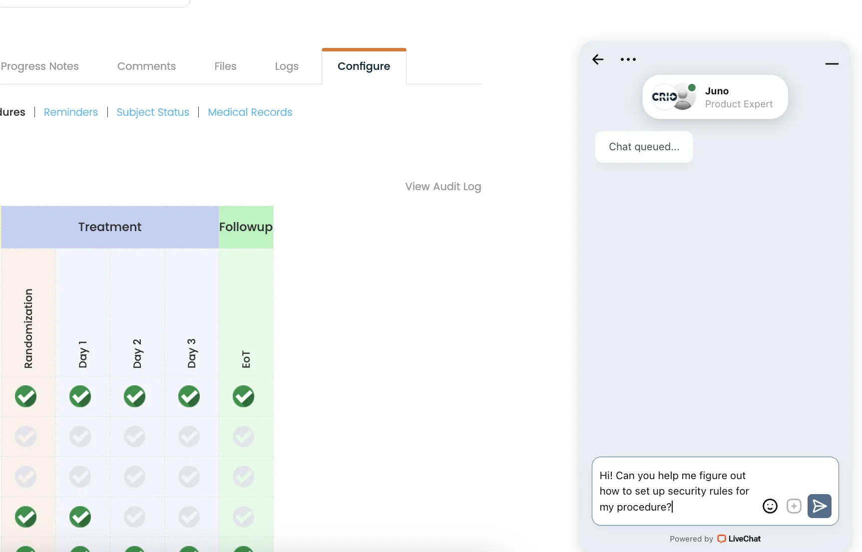 A sidebar live-chat widget overlaid on the app. At the top are back, menu (three dots), and minimize icons. Below is a badge with the CRIO logo, a green “online” dot, and the name “Juno – Product Expert.” A single system bubble says “Chat queued…” At the bottom is the user’s message in the input field: “Hi! Can you help me figure out how to set up security rules for my procedure?” with emoji, attachment, and send-arrow buttons. The footer reads “Powered by LiveChat.”